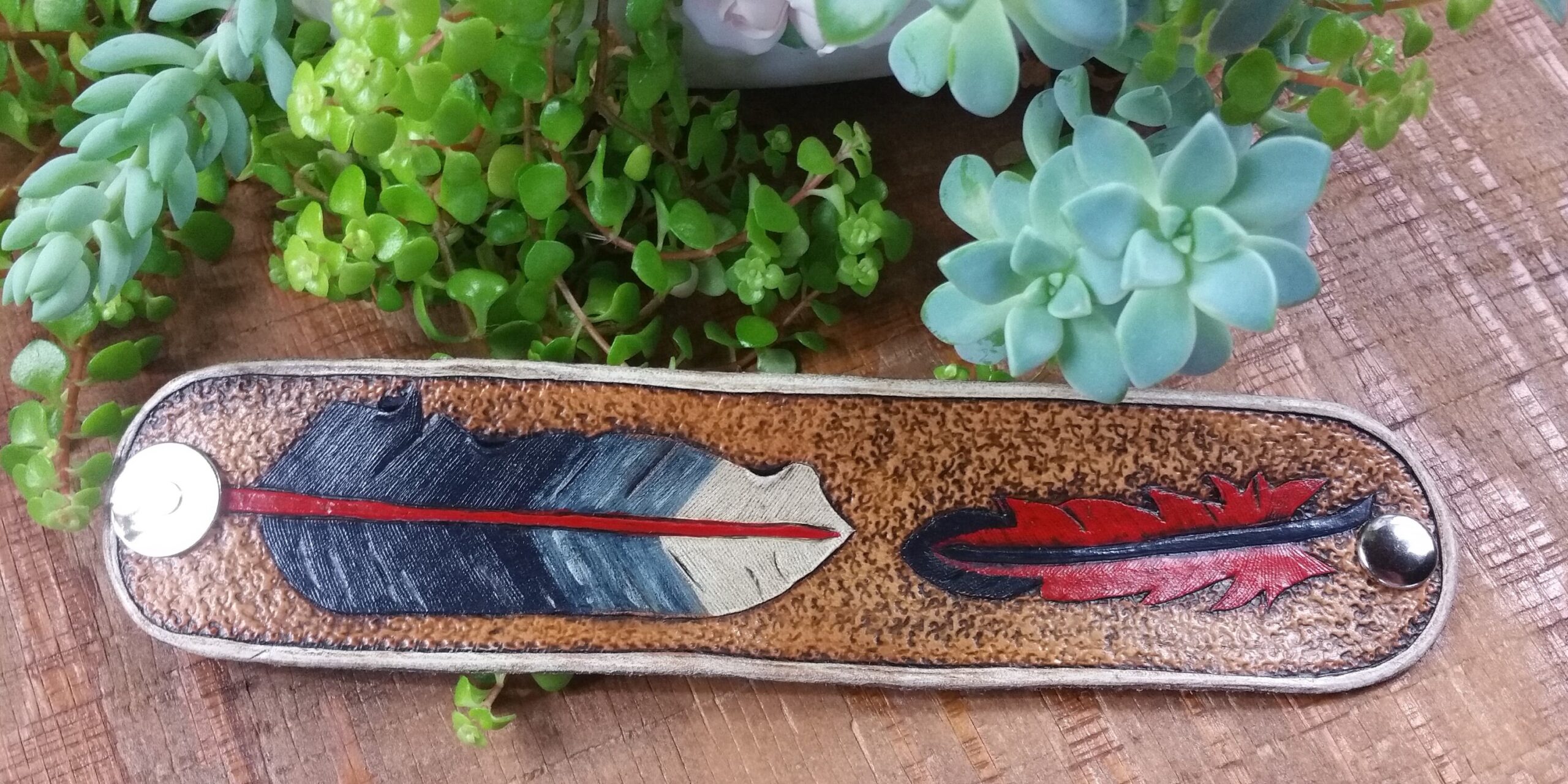 Hand tooled cowhide leather feather bracelet in red, blue and white - Image 4