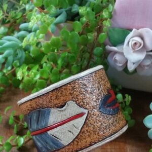 Hand tooled cowhide leather feather bracelet in red, blue and white