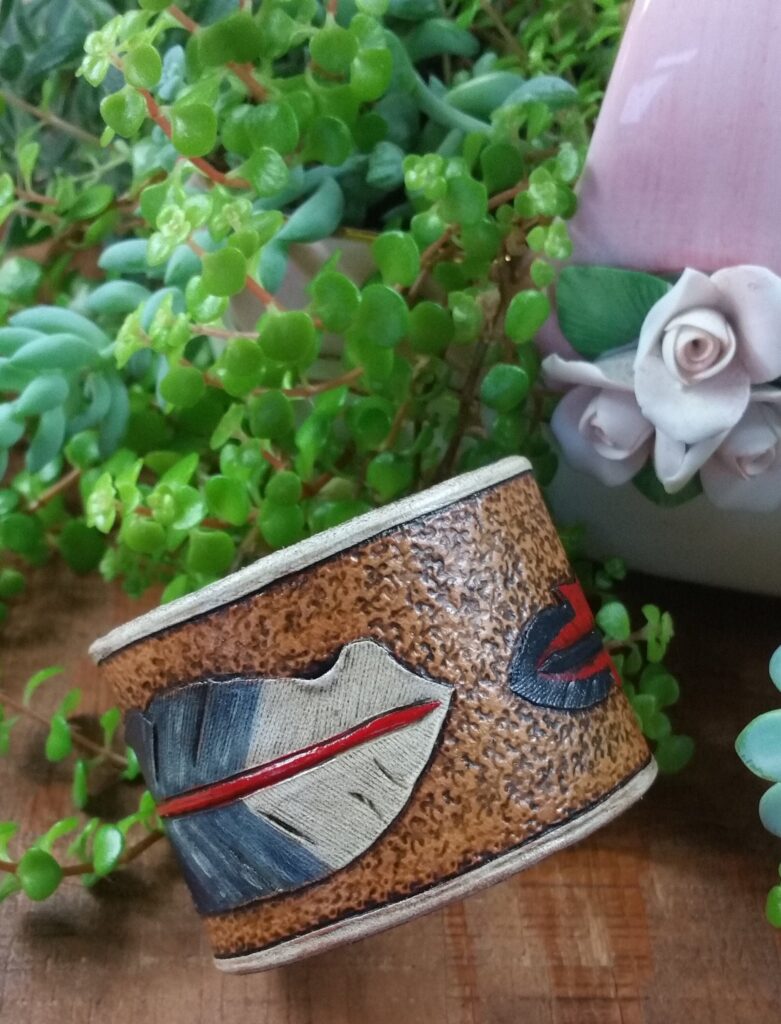 Hand tooled cowhide leather feather bracelet in red, blue and white